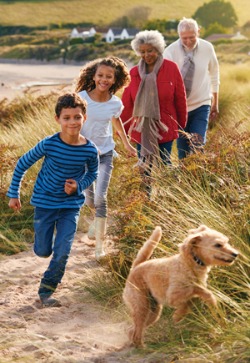 family walking on the beach