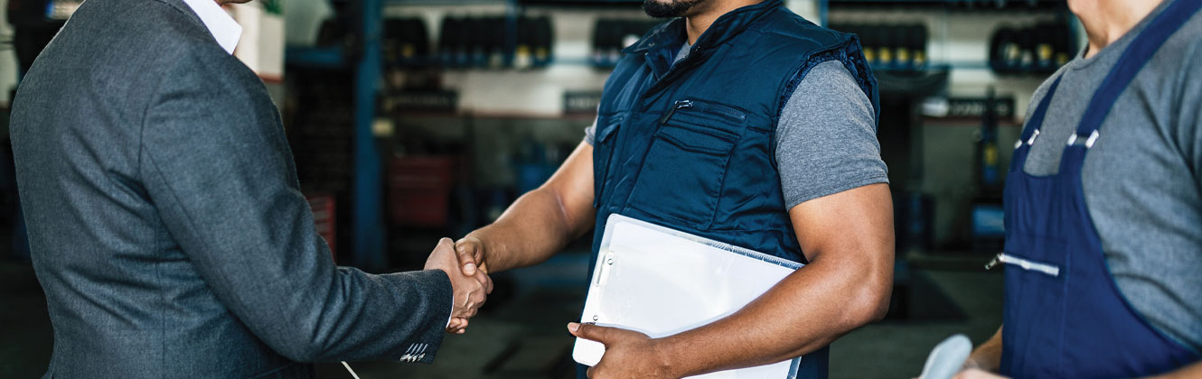 Banker and business owner shake hands