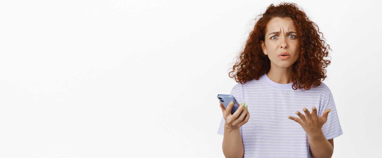 Woman confused by phone