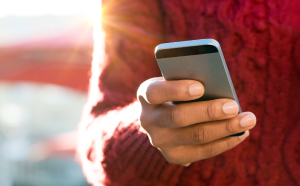 A hand holding a mobile phone