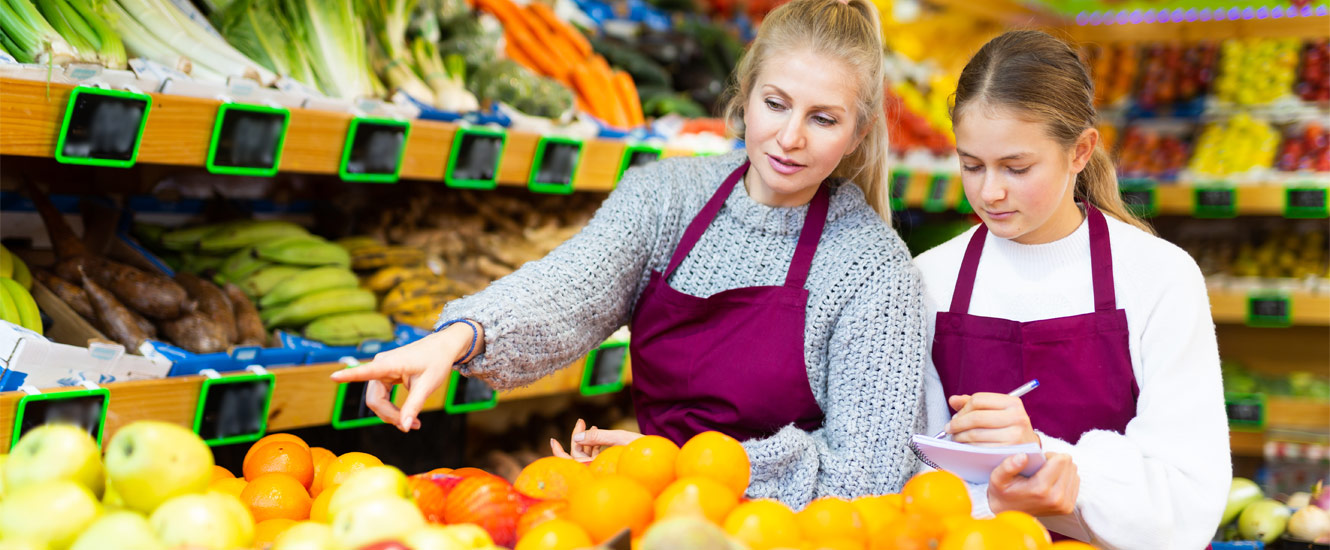 Teenager learning job in grocery store